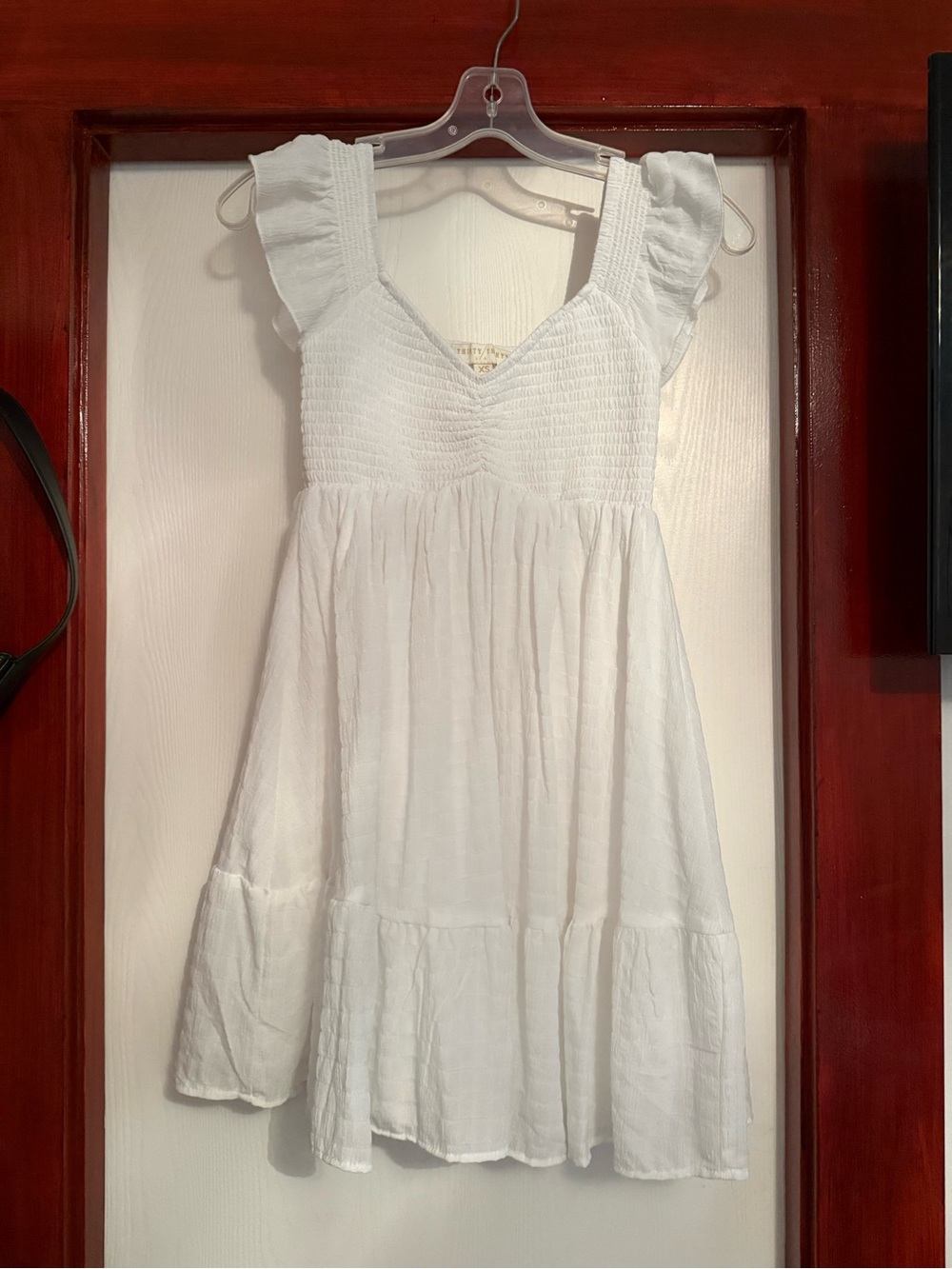 White Smocked V-Neck Mini Dress with Ruffle Sleeves